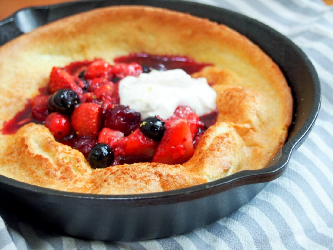 Individual Dutch baby pancake with berries and maple ...