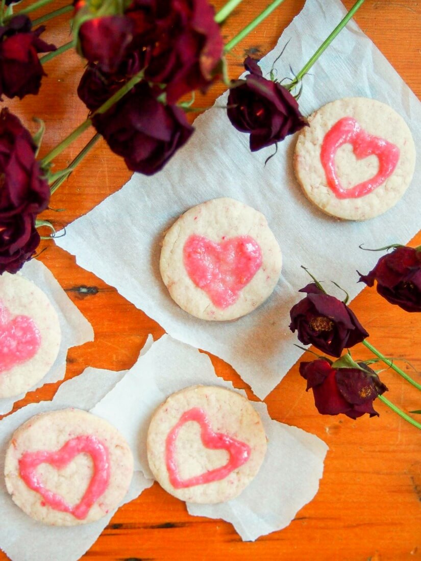 raspberry shortbread love hearts with raspberry cream cheese frosting - a deliciously buttery, raspberry-flavored cookie perfect for Valentine's day, or any excuse they're that good. Naturally colored, they'll win your heart.