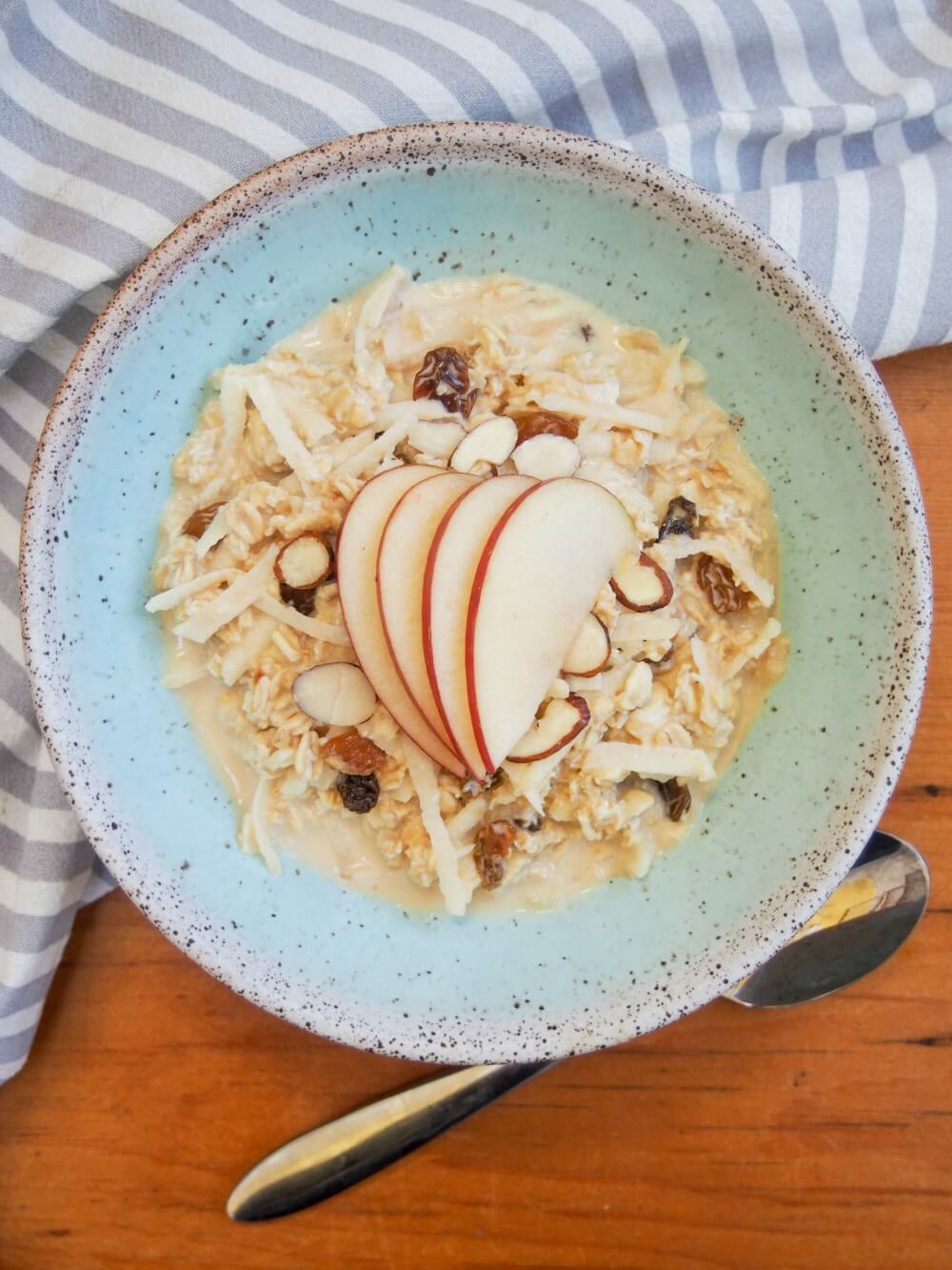bowl of Swiss bircher muesli (topped with slices of apple from overhead