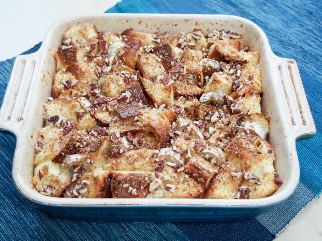 This overnight baked banana French toast is easy to make and delicious with bananas baked in and a touch of brown sugar and pecans crisped on the top.
