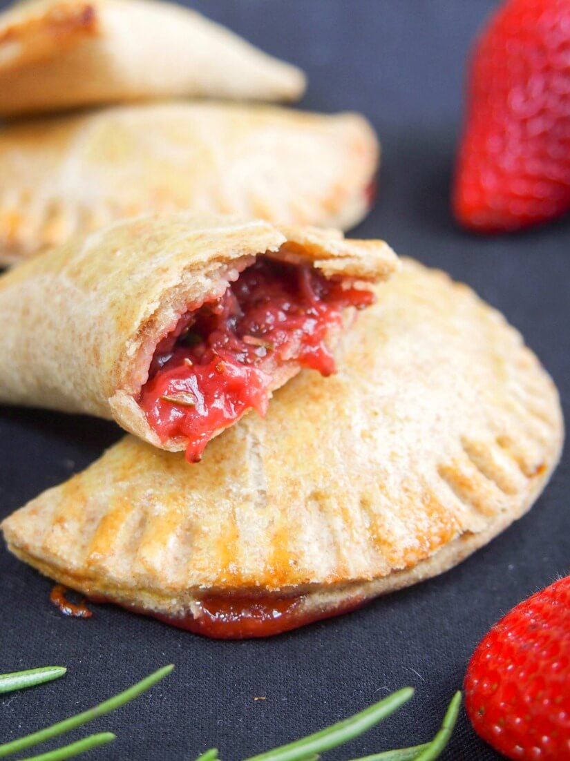 These strawberry empanadas have a fruit filling infused with rosemary, with optional chocolate chips for a delicious sweet treat that's relatively healthy.
