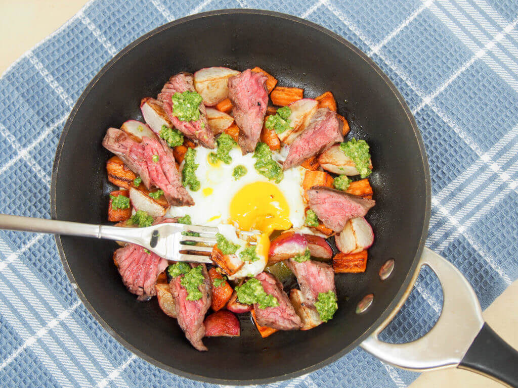 Treat someone to this steak & egg breakfast skillet with sauteed radishes, carrots and radish green pesto - it's a delicious balance of flavors, & easy too.