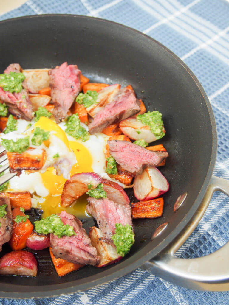Treat someone to this steak & egg breakfast skillet with sauteed radishes, carrots and radish green pesto - it's a delicious balance of flavors, & easy too.