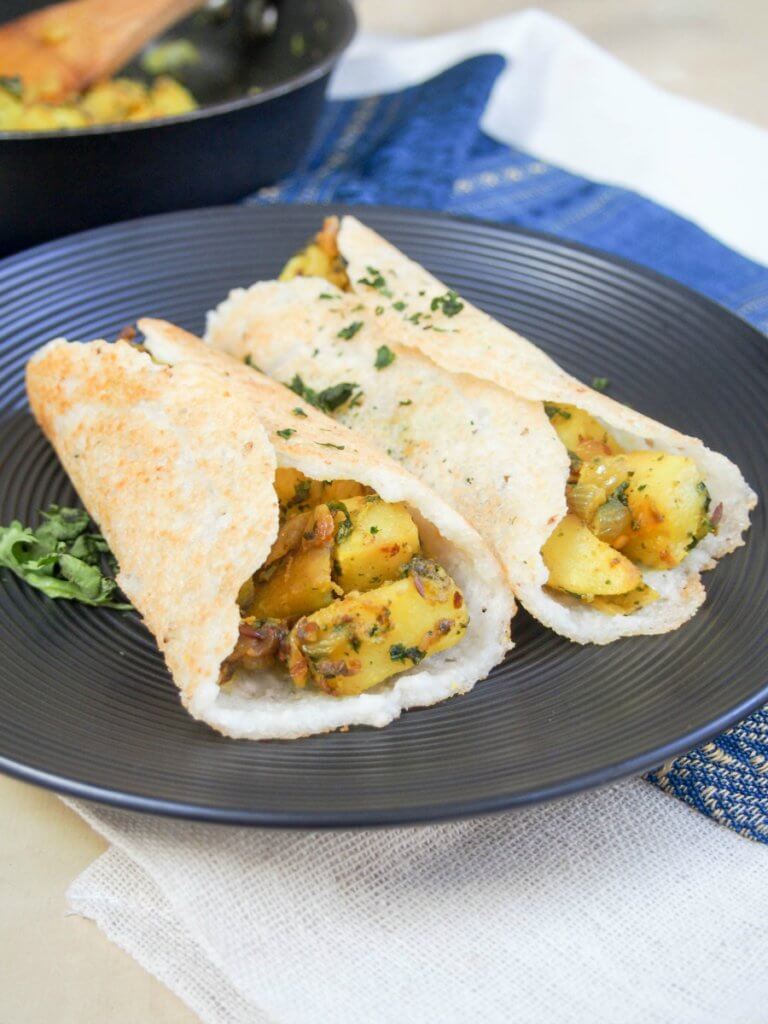 masala dosa on plate with spiced potato filling