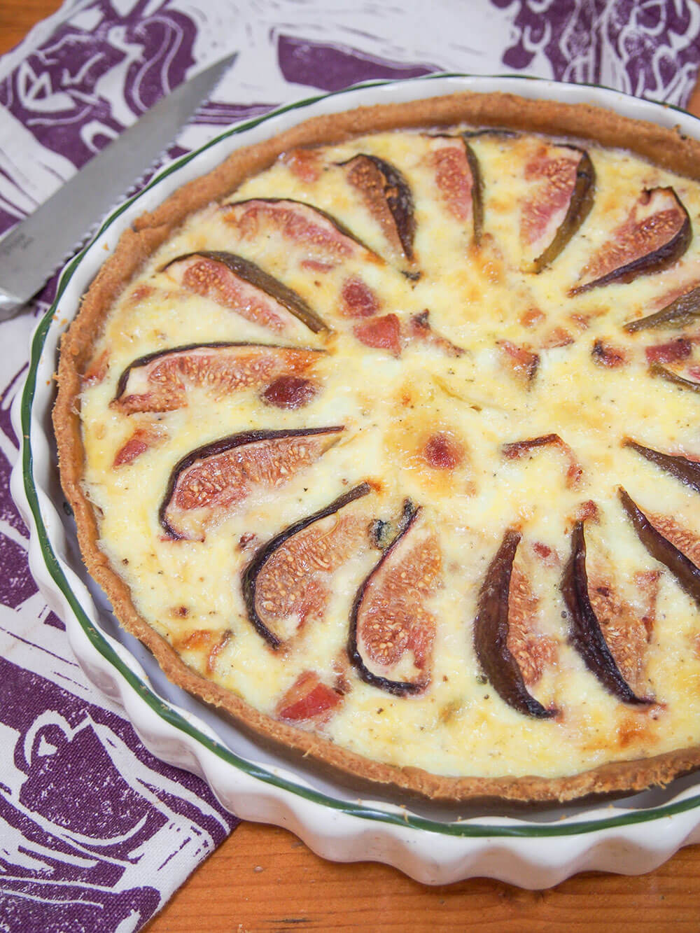 fig, goat's cheese and bacon quiche before slicing