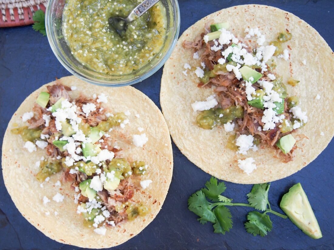 Pork carnitas tacos with tomatillo salsa verde