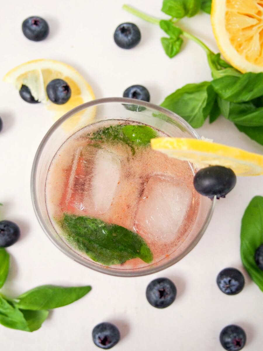 bashful blueberry cocoktail This bashful blueberry cocktail is a delicious mix of blueberries, lemon, vermouth, whiskey and a hint of basil. Topped with soda, it's a refreshing drink. Easy to make & enjoy!