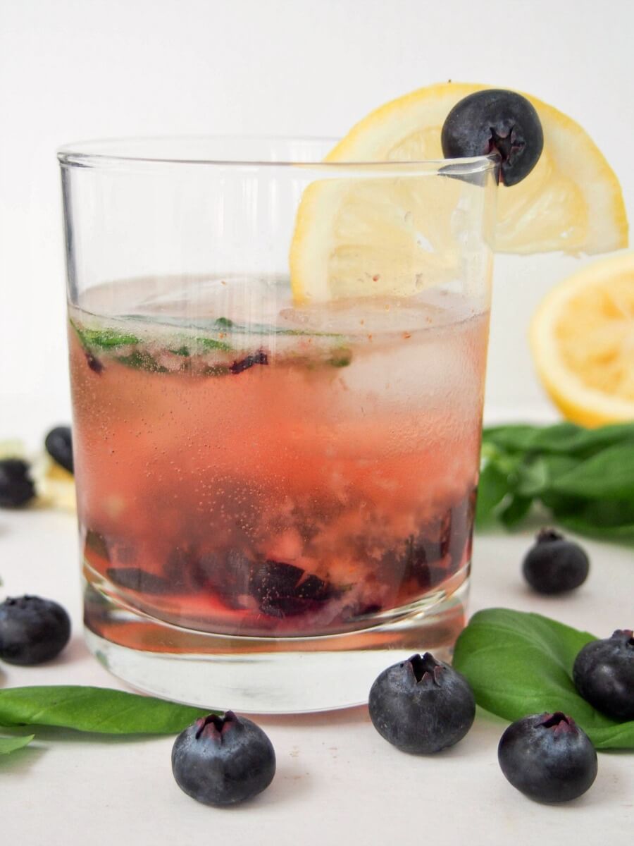 bashful blueberry cocktail This bashful blueberry cocktail is a delicious mix of blueberries, lemon, vermouth, whiskey and a hint of basil. Topped with soda, it's a refreshing drink, perfect for summer