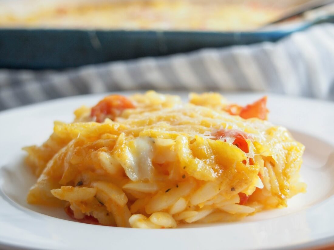 serving of cheesy orzo pasta bake on plate