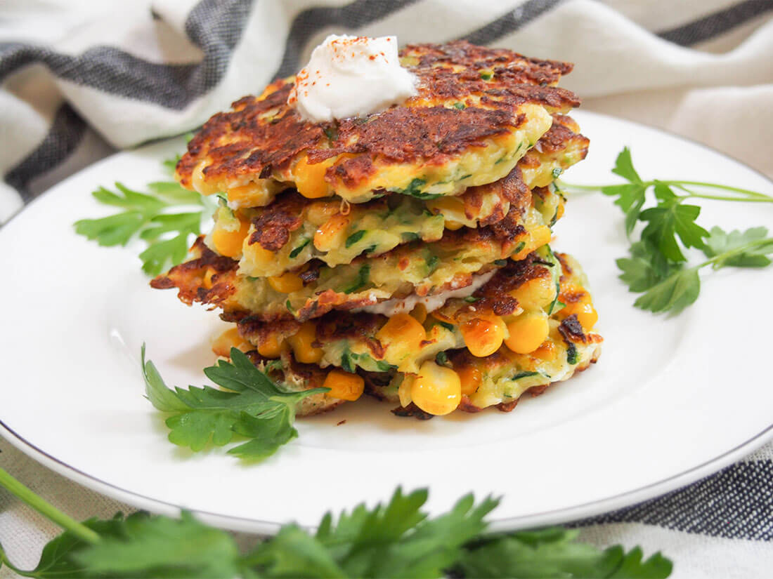 stack of zucchini corn fritters on plate