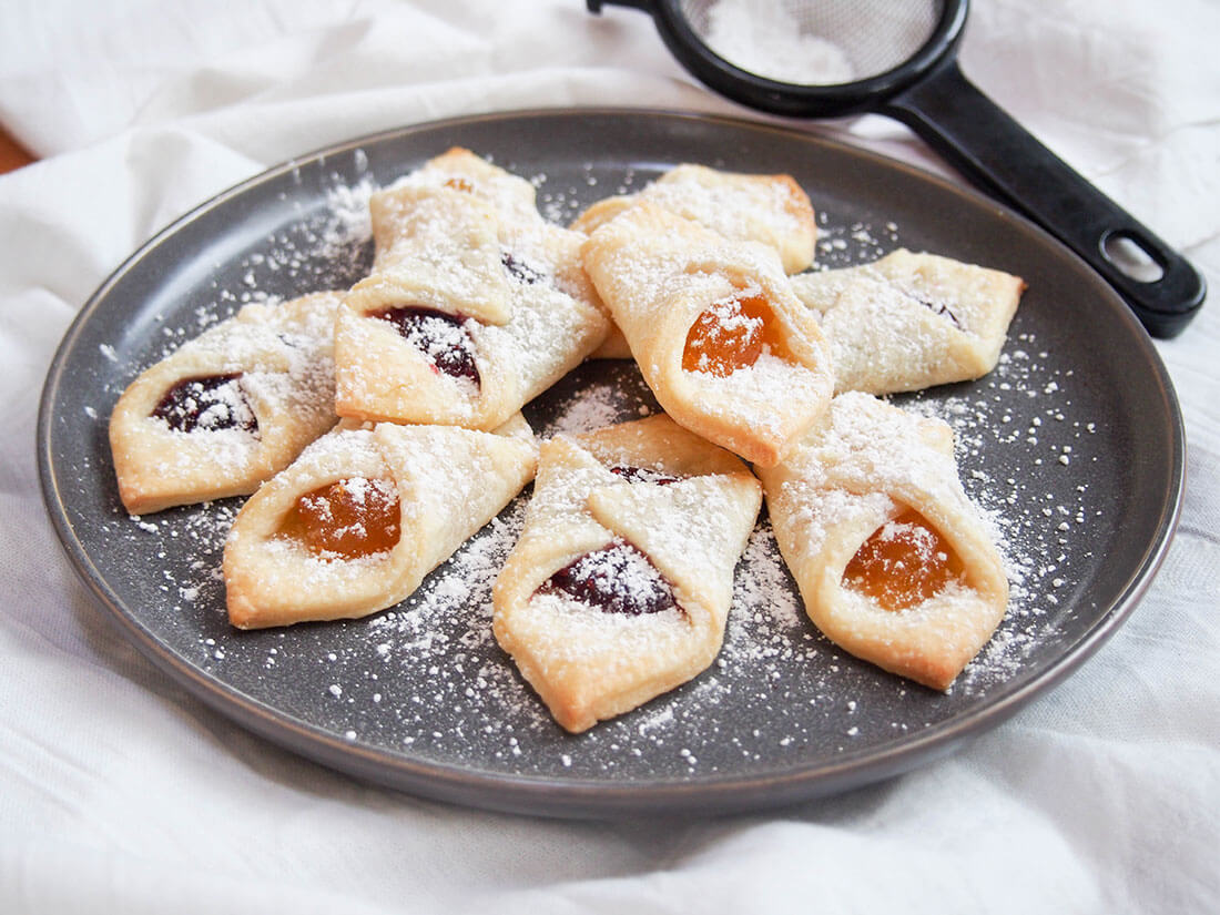 kolachy cookies on plate, dusted with powdered sugar