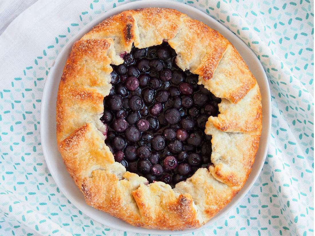 whole blueberry galette on plate