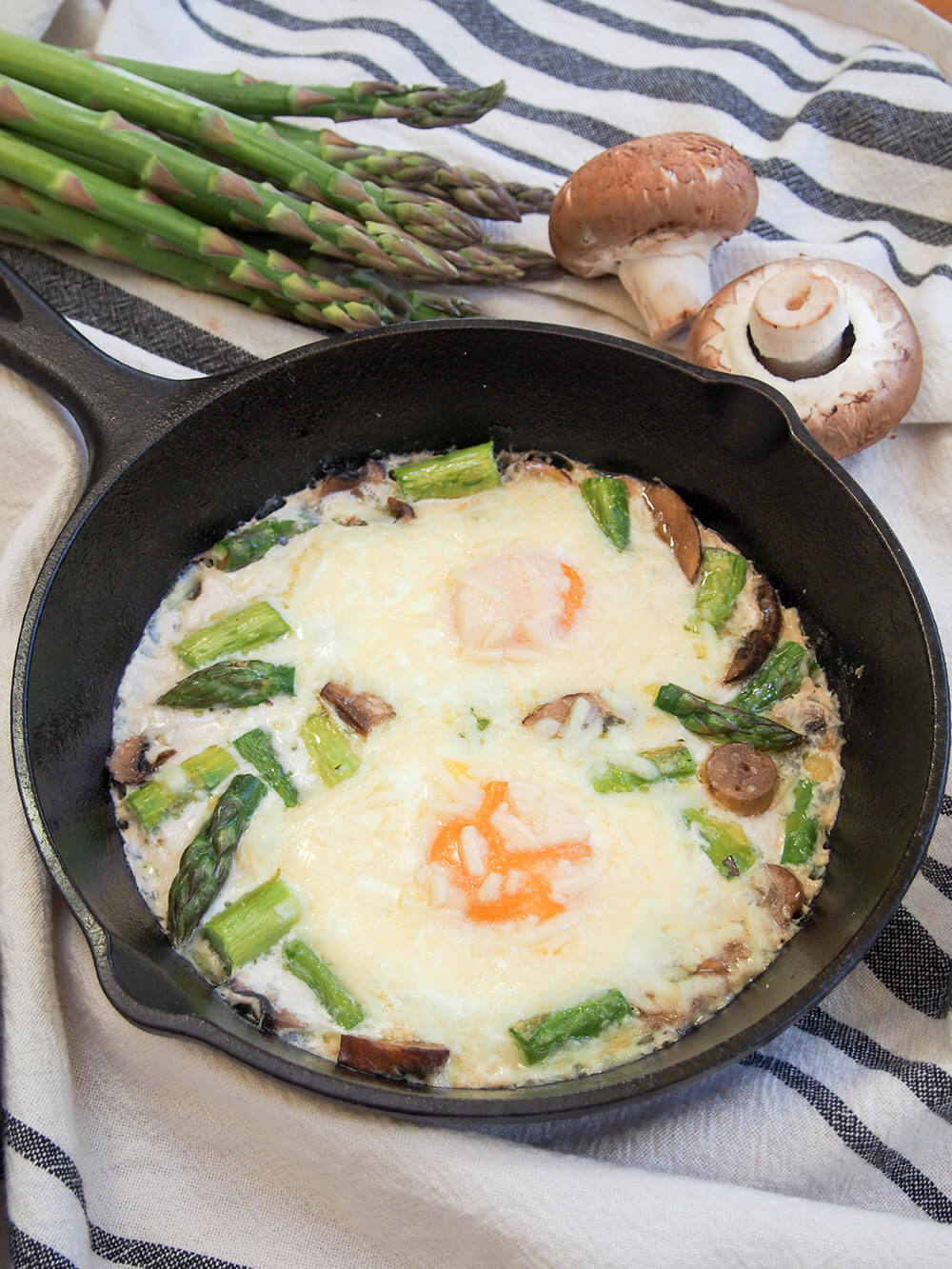 Baked eggs with mushrooms and asparagus