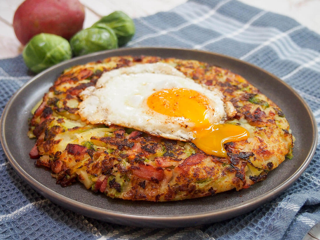 bubble and squeak with egg on top and yolk running