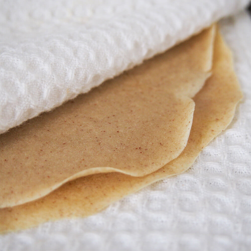 buckwheat crepes being kept warm in cloth