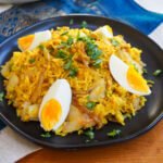 plate of kedgeree topped with egg