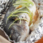 Chinese oven steamed fish close up in foil
