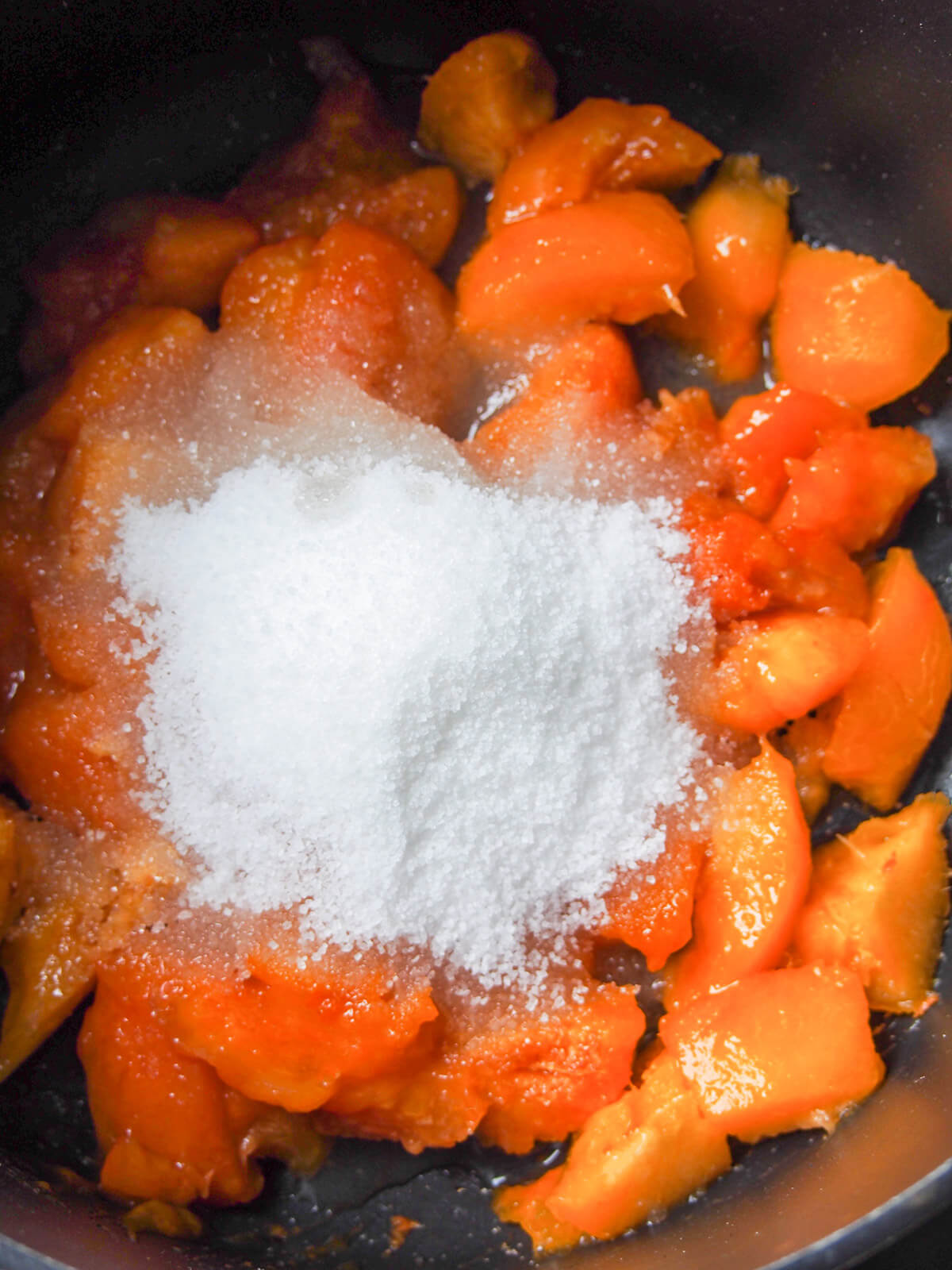 apricots, sugar and lemon juice in pan ready to cook