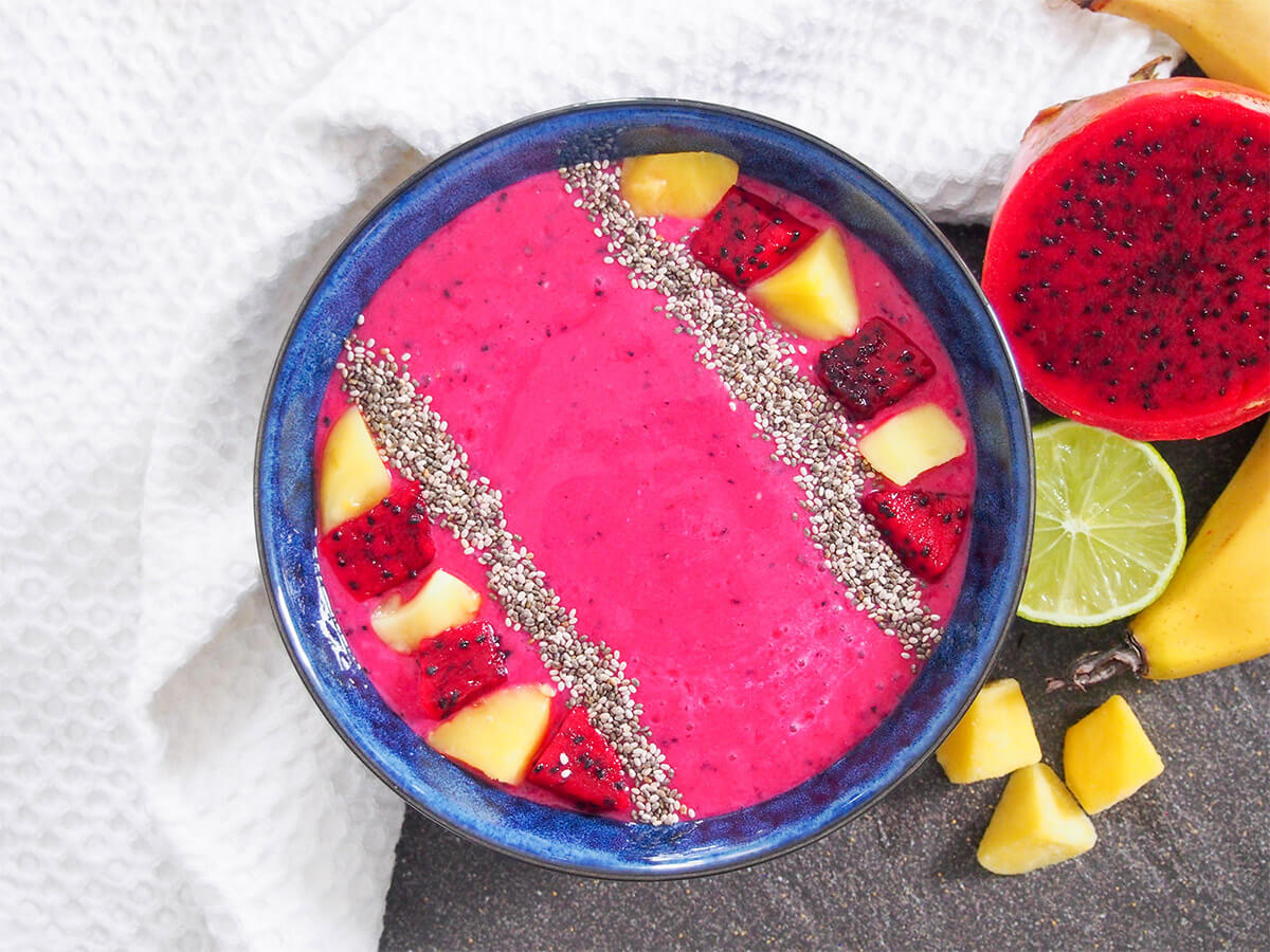 mango dragon fruit smoothie with fruits to side
