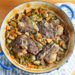 dish with braised lamb shoulder chops and vegetables