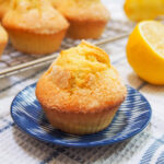 magdalenas Spanish muffins on plate with part lemon and more behind