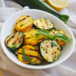 bowl of marinated grilled zucchini and summer squash