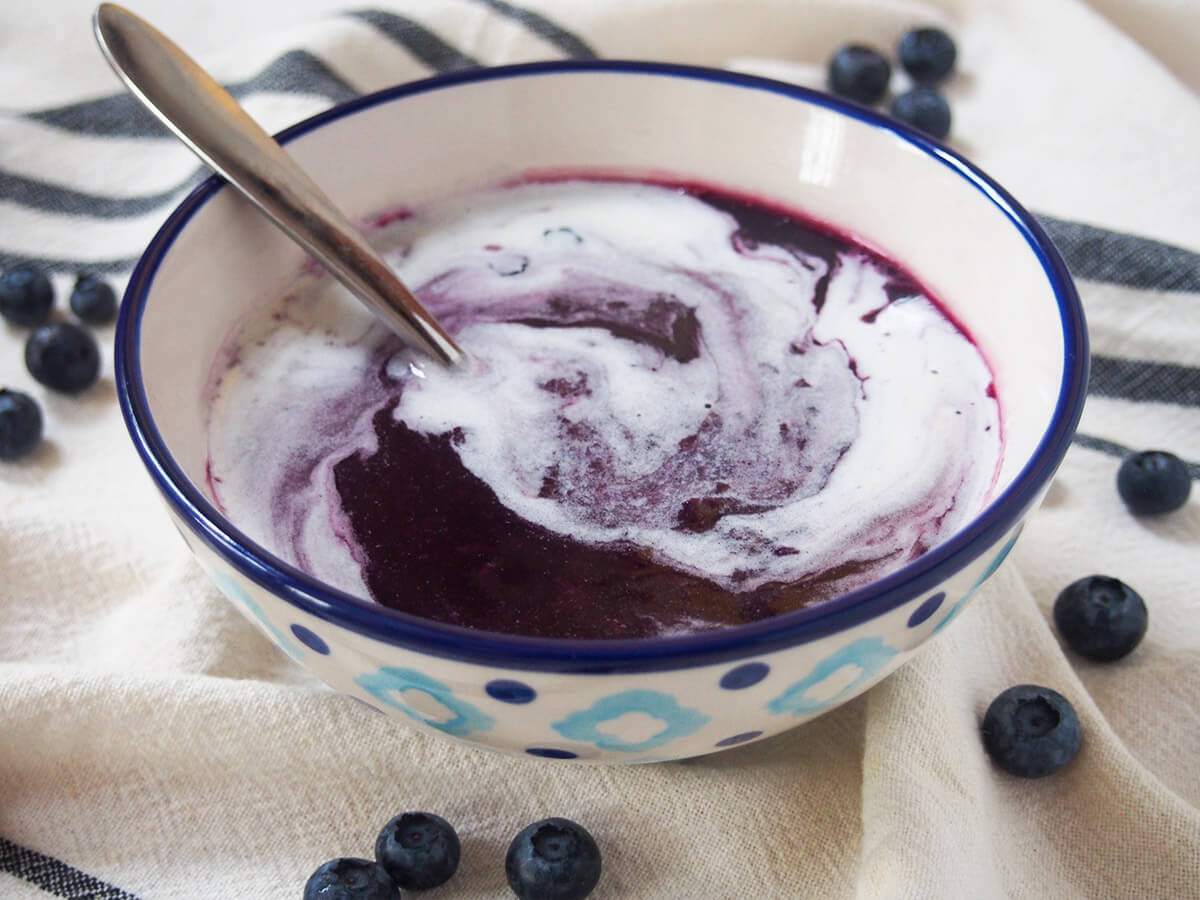 bowl of Swedish blueberry soup with spoon in bowl