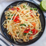 overhead view of plate of Thai green papaya salad