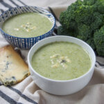 two bowls of broccoli and stilton soup