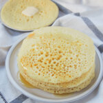 stack of baghrir Moroccan pancakes on plate.