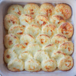 dish of semolina gnocchi, gnocchi alla Romana, from overhead.
