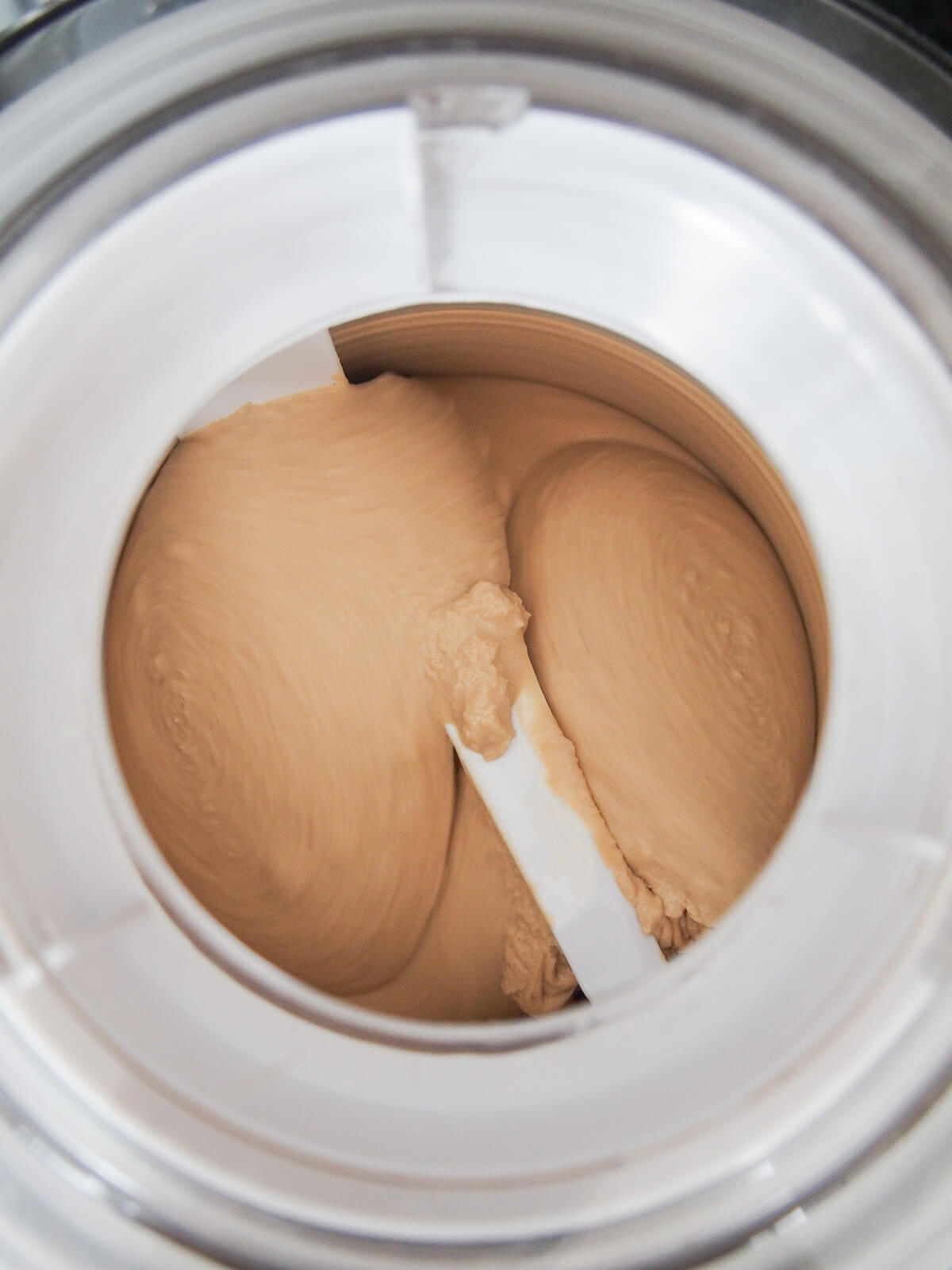 churning chai ice cream in ice cream maker