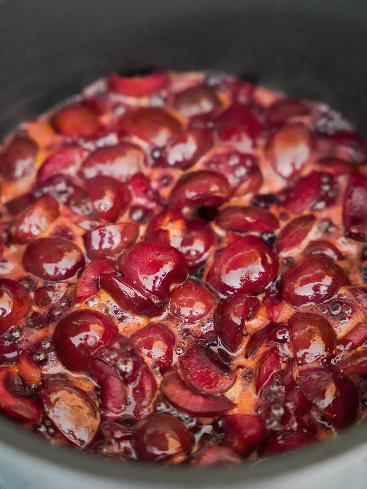 simmering cherries and juices in pot