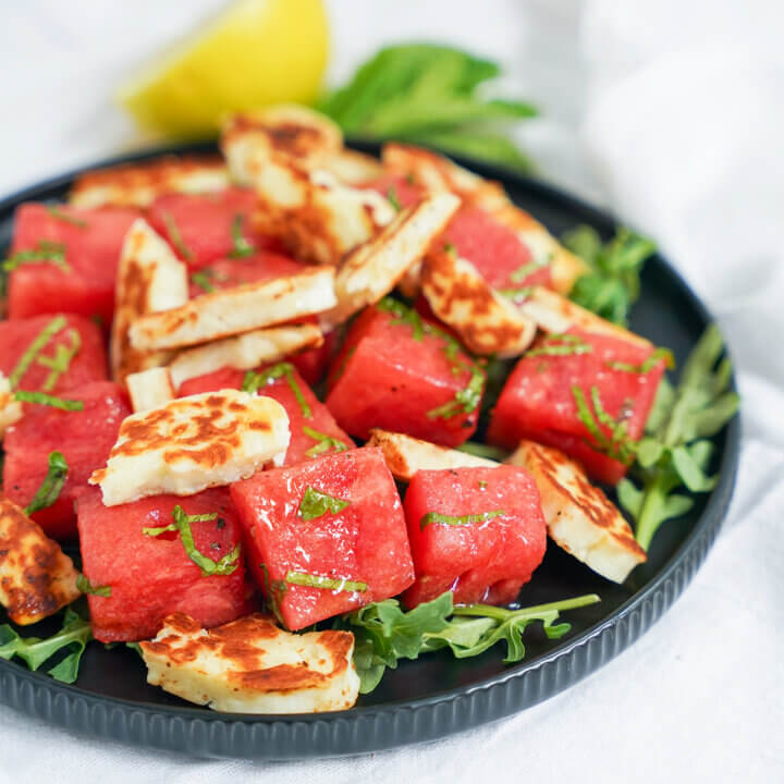 side close up view of plate of halloumi and watermelon salad.