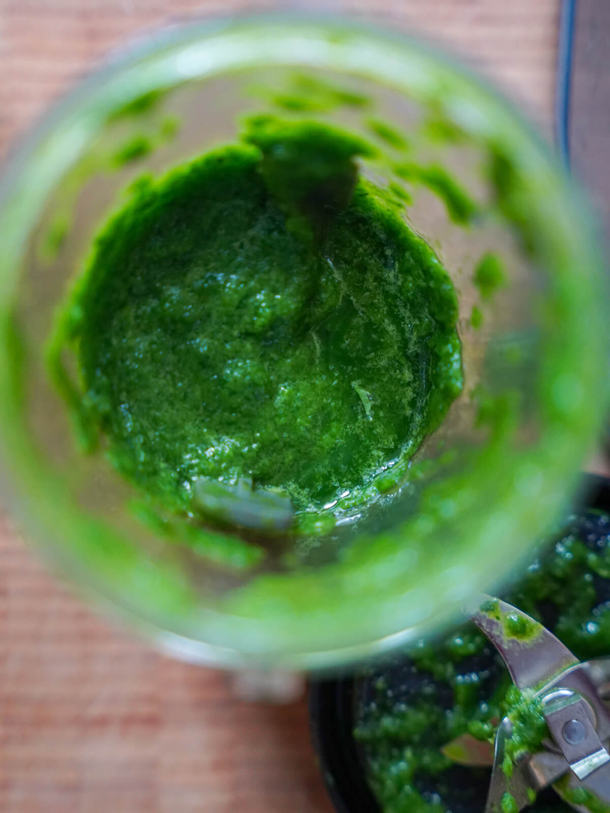 looking in blender with green herby paste inside.