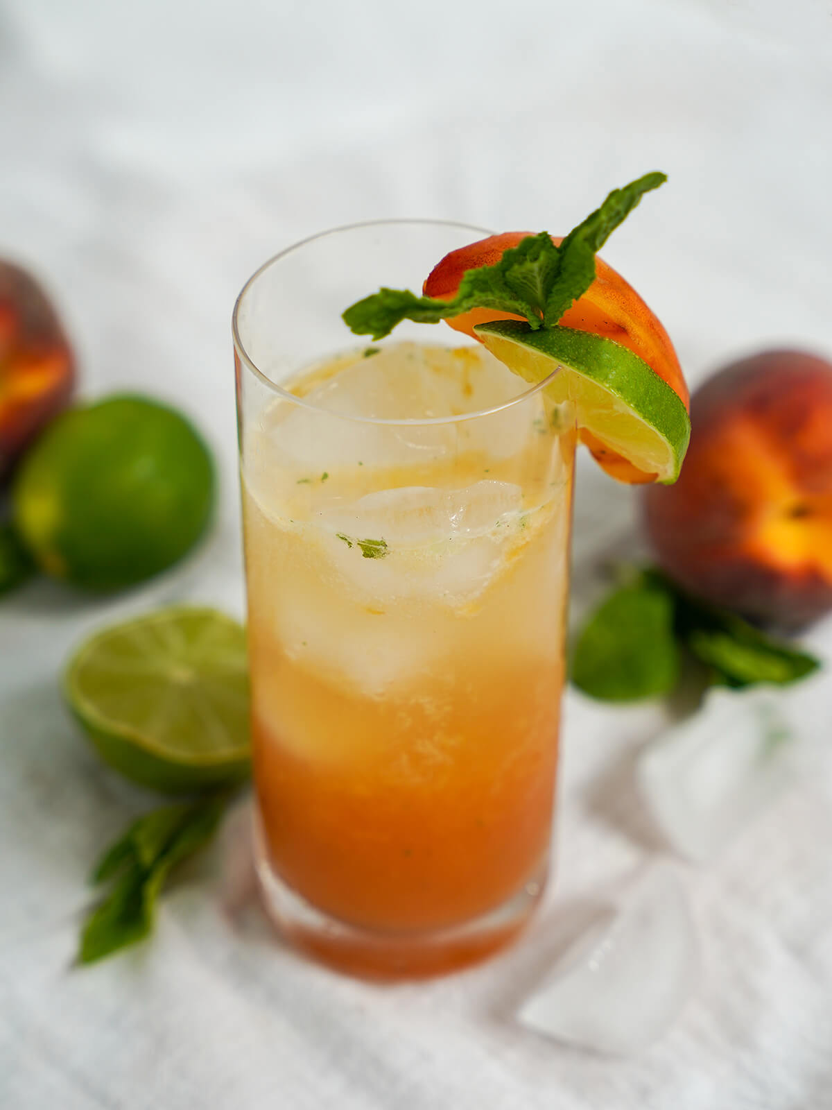 top side view of glass of peach mojito.