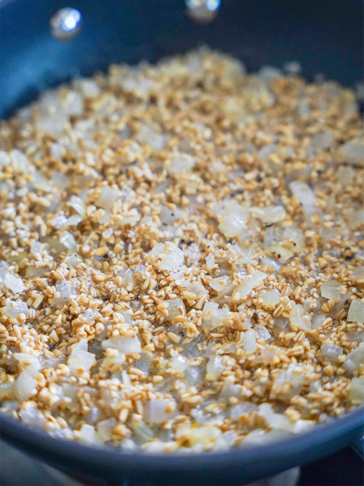 oats added to onion in skillet.