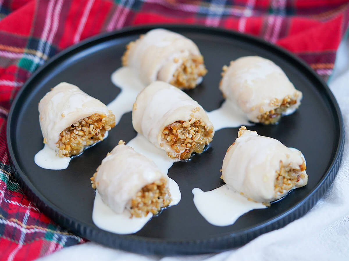 plate of chicken with oatmeal stuffing topped with whisky cream sauce.