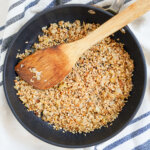 overhead view of skillet of skirlie oatmeal stuffing.