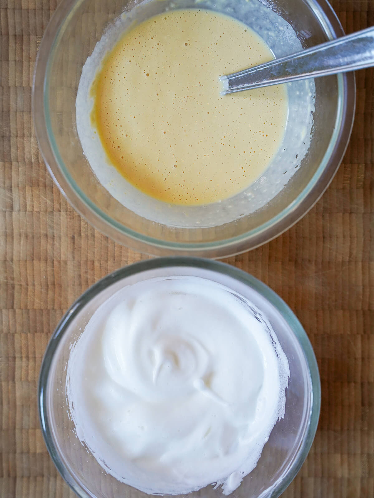 bowl with flour, milk and egg yolk mixture and other bowl with beaten egg whites.
