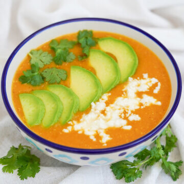side view of bowl of locro de papa, Ecuadorean potato soup.