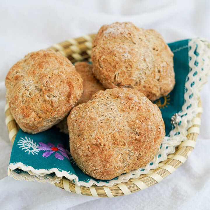 close view of Irish soda bread rolls in a cloth-lined basket