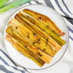 overhead view of a plate of braised leeks.