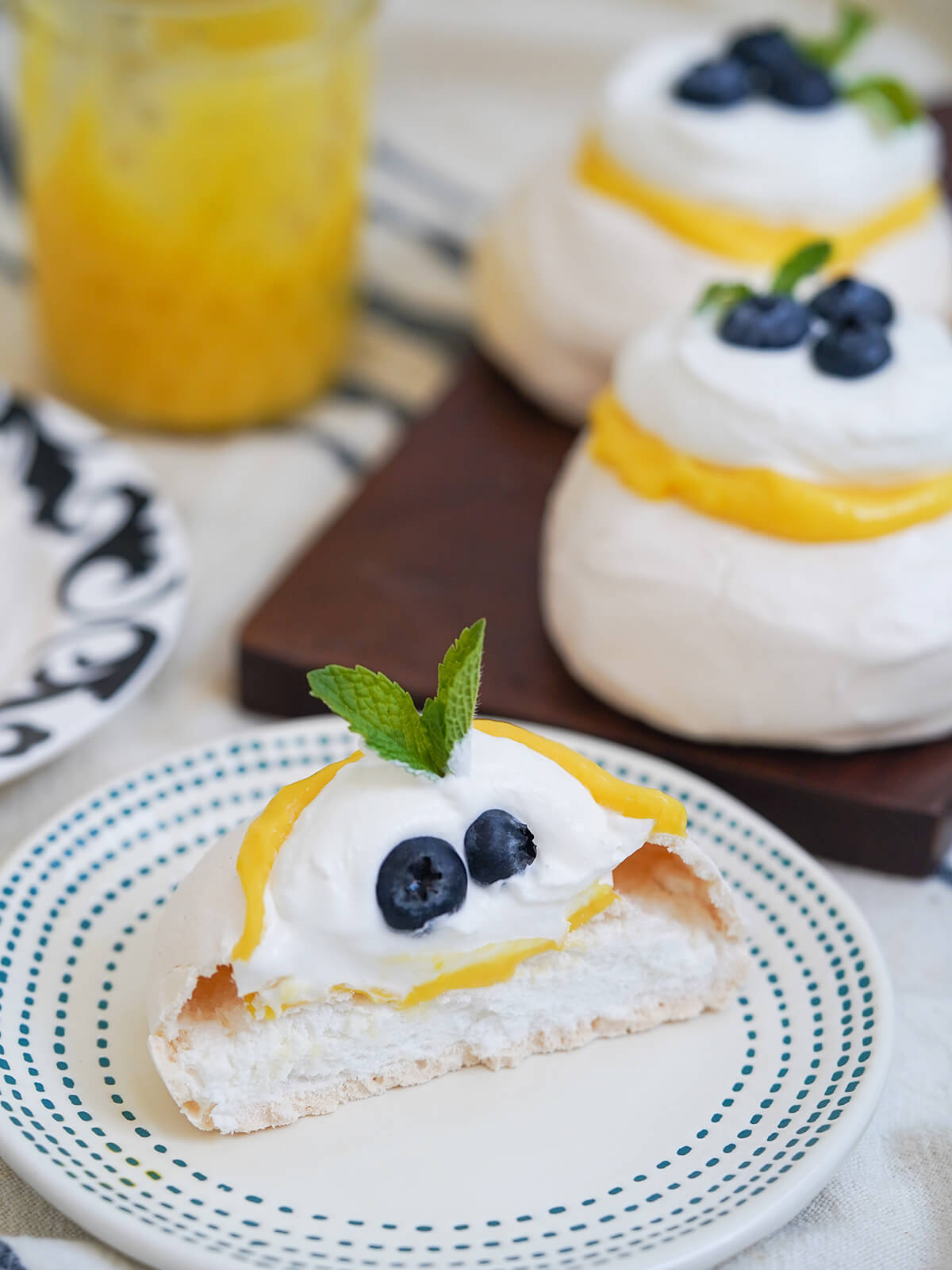 sliced open mini lemon pavlova showing marshmallow like filling.