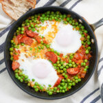 overhead view of a skillet of Portuguese peas and eggs.