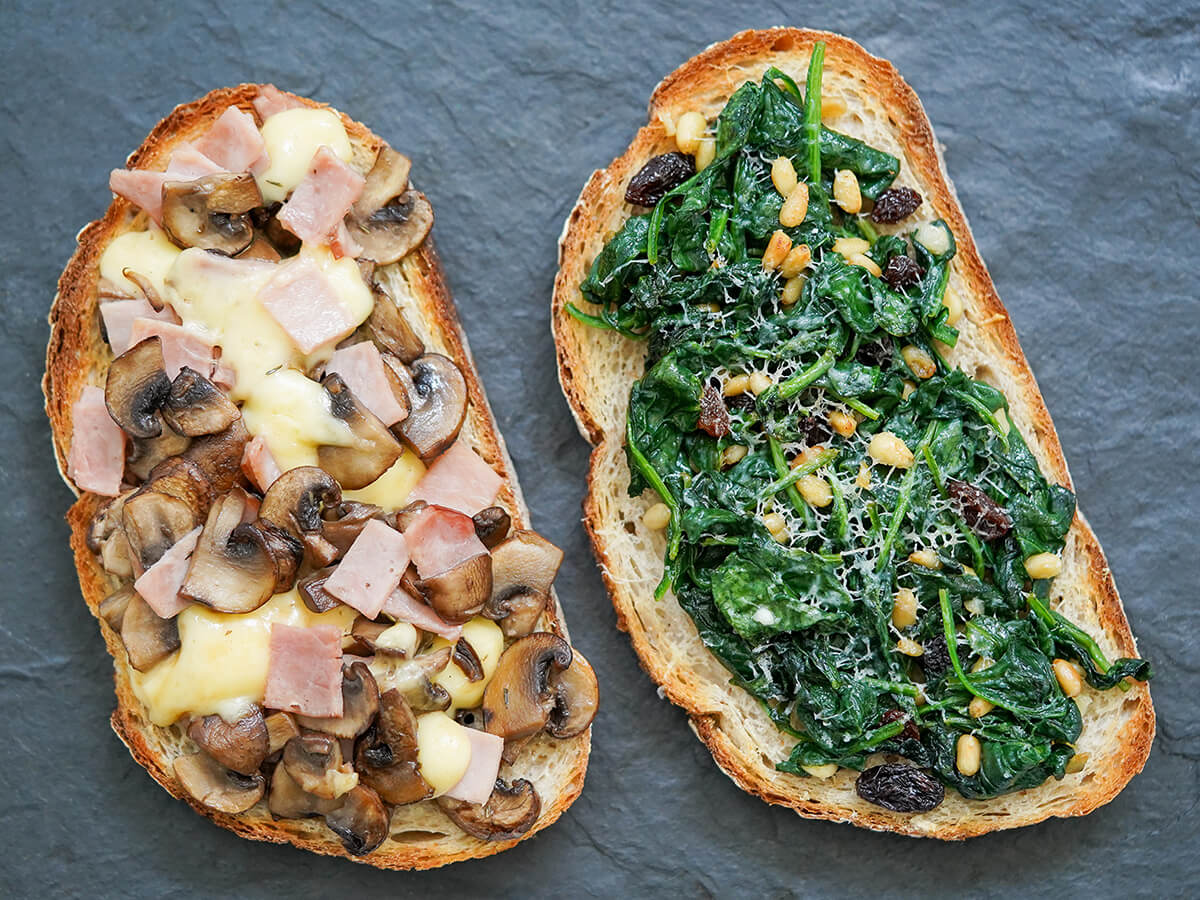llescas Catalan bread pizza two llescas, Catalan loaded toasts, with different toppings side by side.