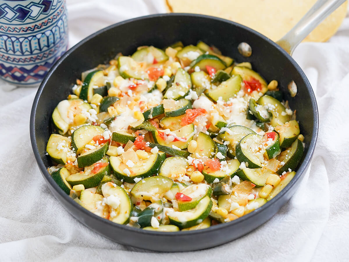 skillet of calabacitas Mexican zucchini side view of skillet of calabacitas, Mexican zucchini.