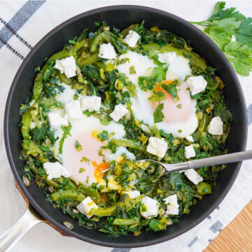 overhead close view of skillet of green shakshuka.