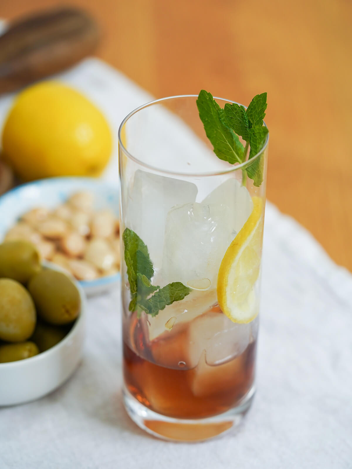 sherry, ice cubes and mint in a glass.