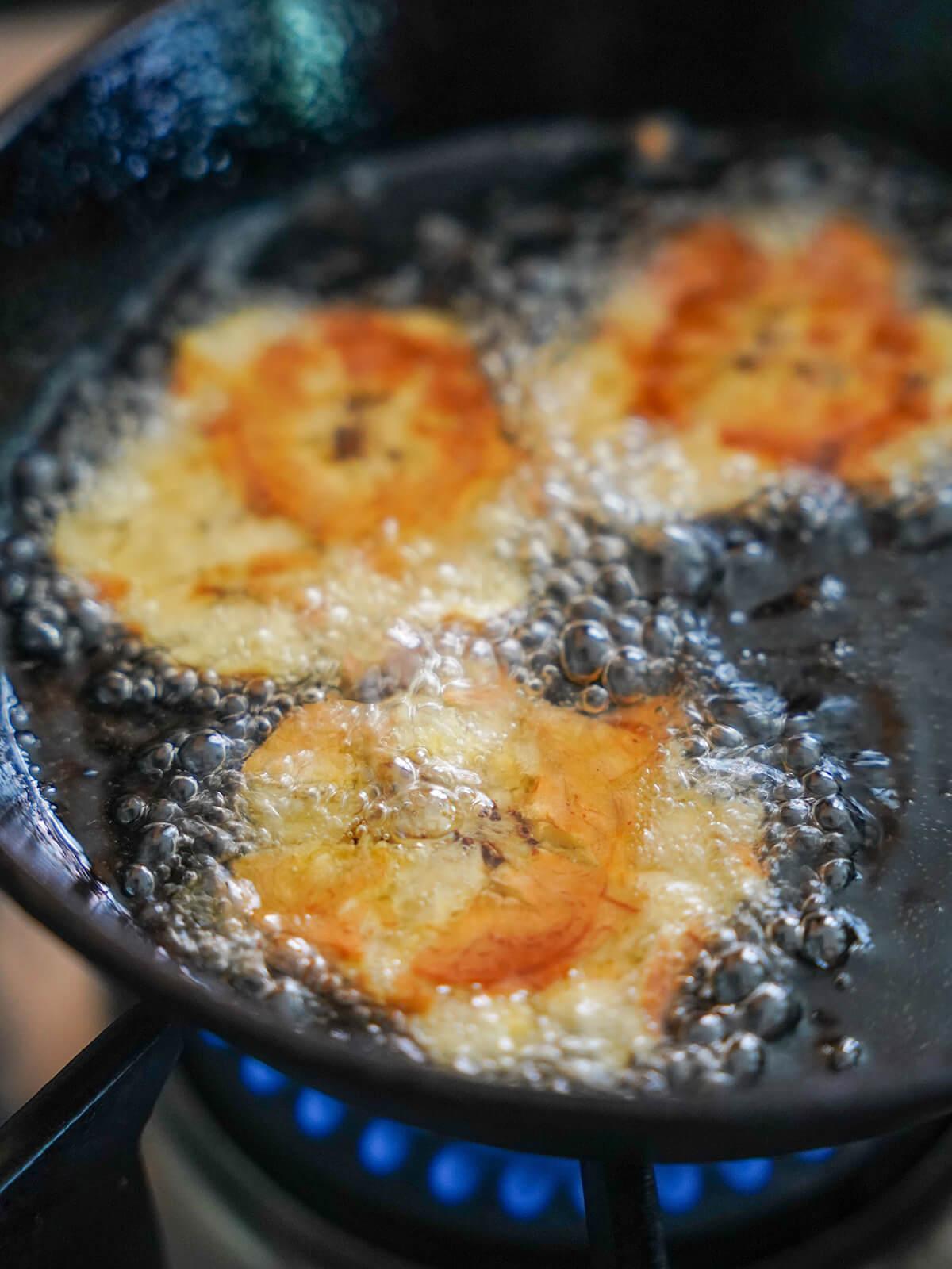 frying patacones aka tostones in oil.